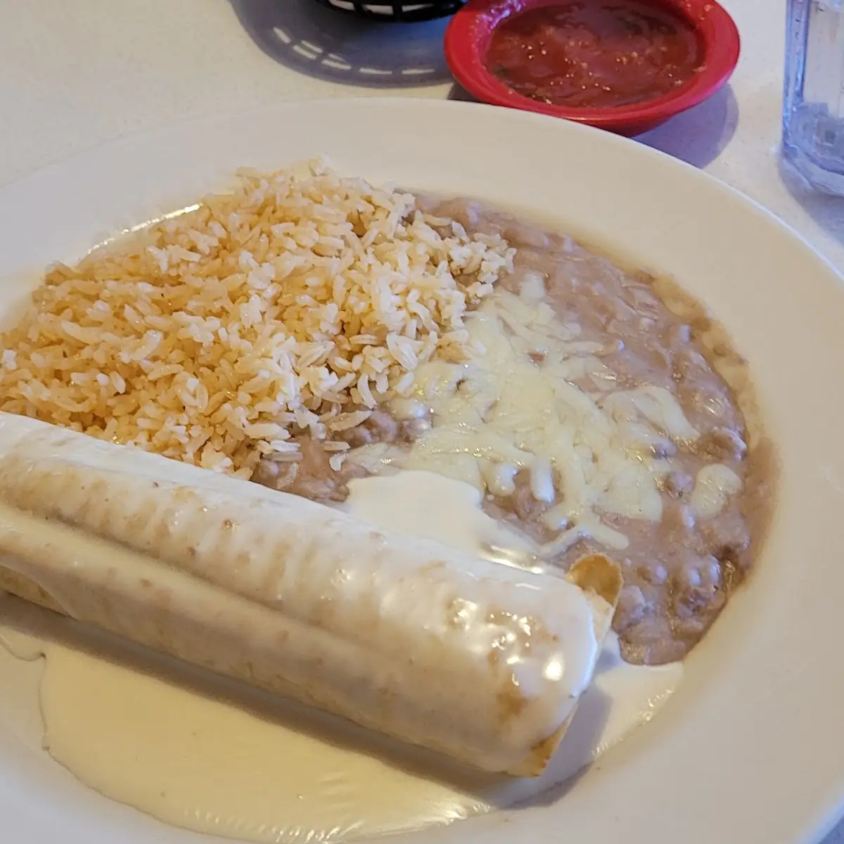 One Burrito with Cheese Sauce & Rice