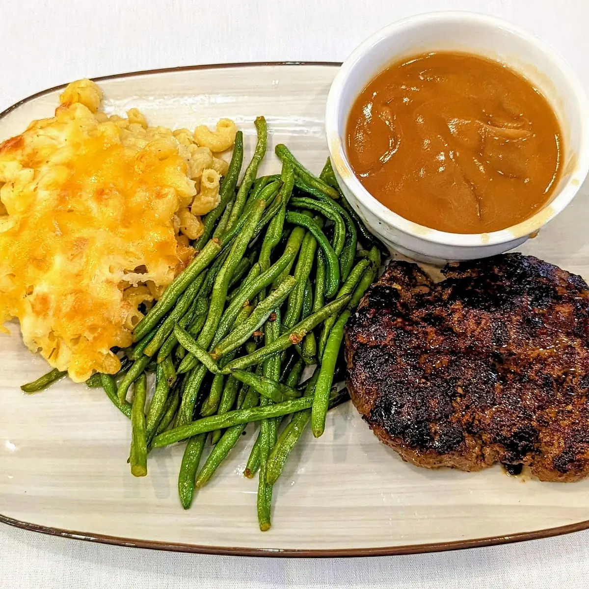 Hamburger Steak with Macaroni and Cheese Green Beans and Gravy