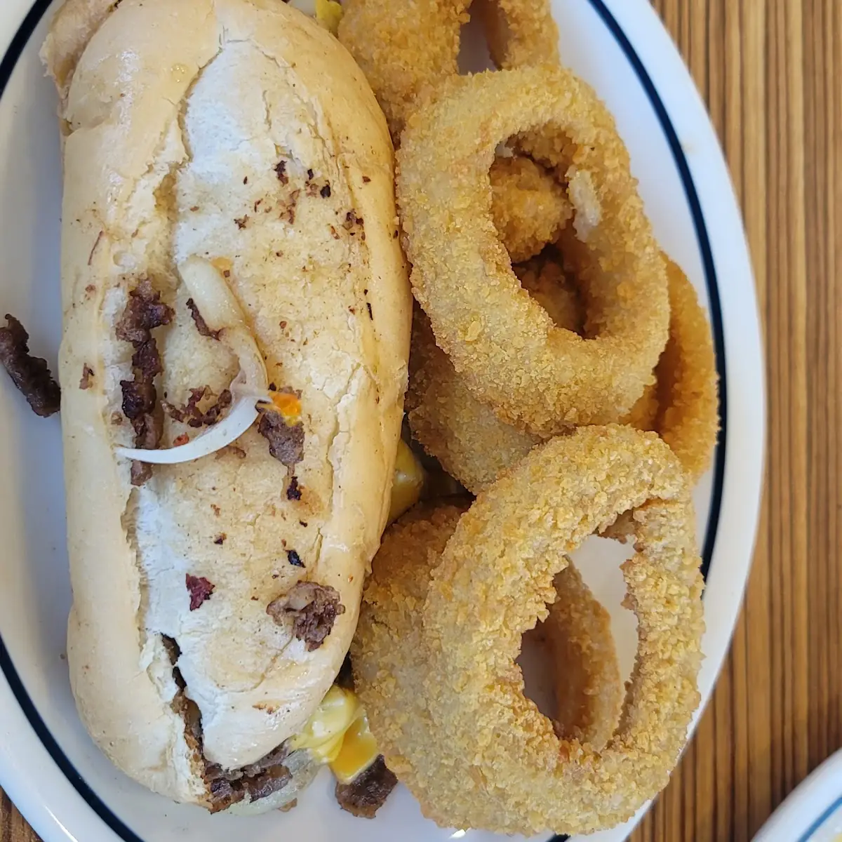 Philly Cheese Steak Sandwich with Onion Rings