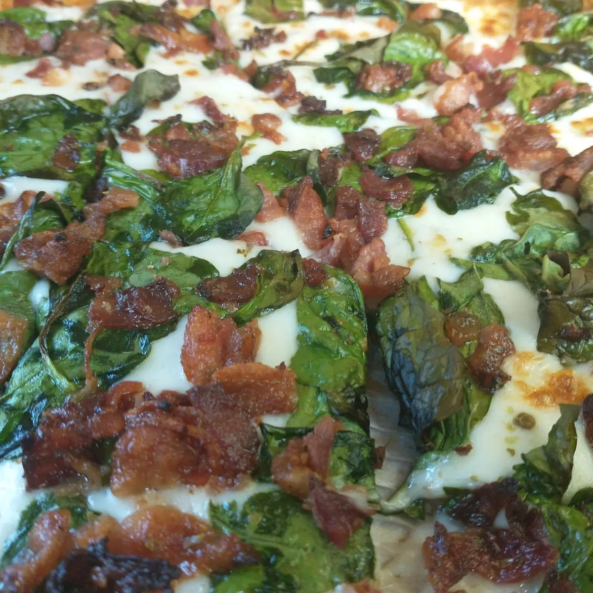 Thin Crispy Pizza Parmesan Garlic Sauce Bacon and Spinach