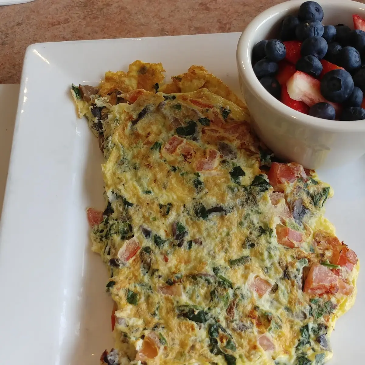 Omelette with Spinach Mushroom and Tomato with Great Fruit