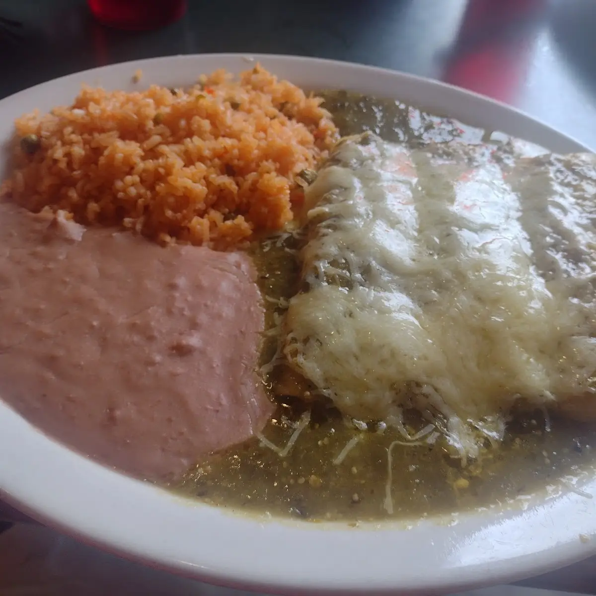 Enchiladas De Queso En Salsa Verde with Rice and Beans