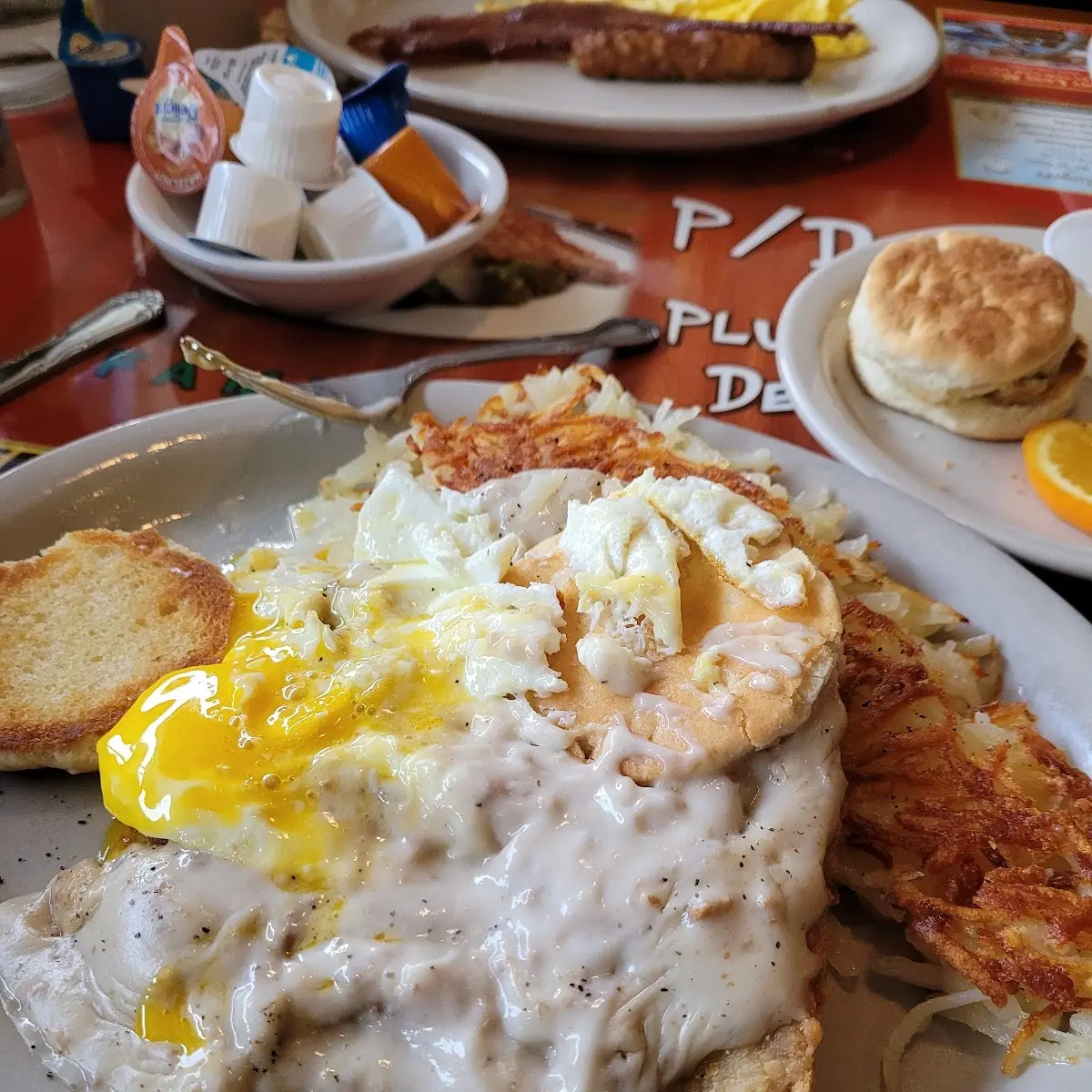 Chicken Fried Steak on the Left Sausage Eggs and Hash Browns on the Right