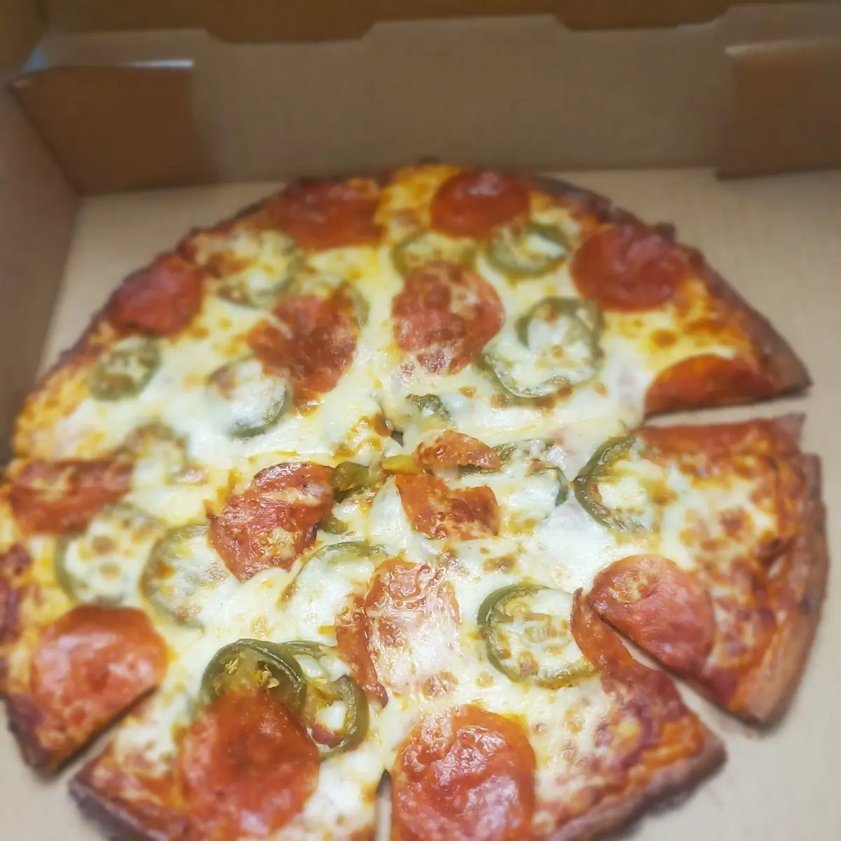 Cauliflower Crust Pepperoni Pizza and Jalapeños