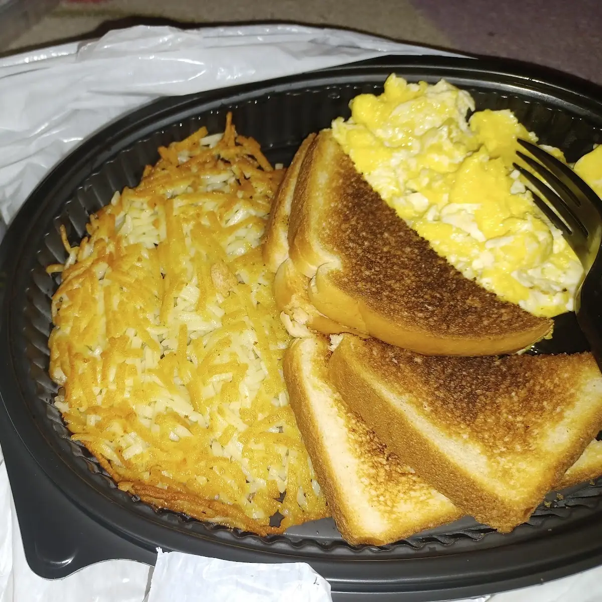Scrambled Eggs Hash Browns Grits and Toast