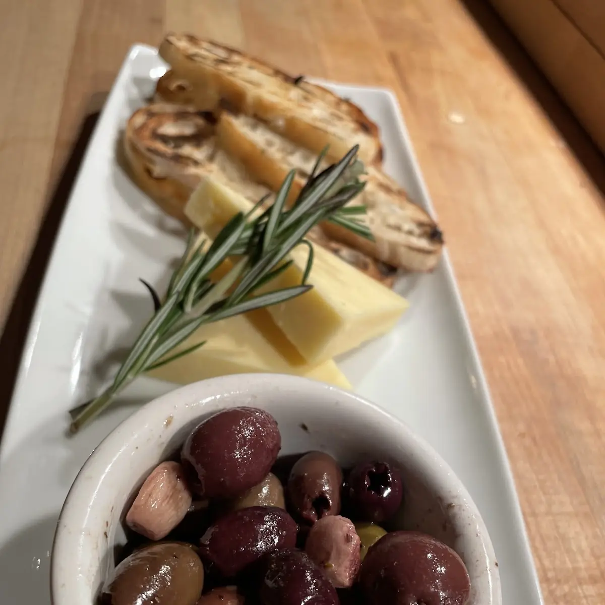 Warm Olives with Cheddar Cheese & Crostini