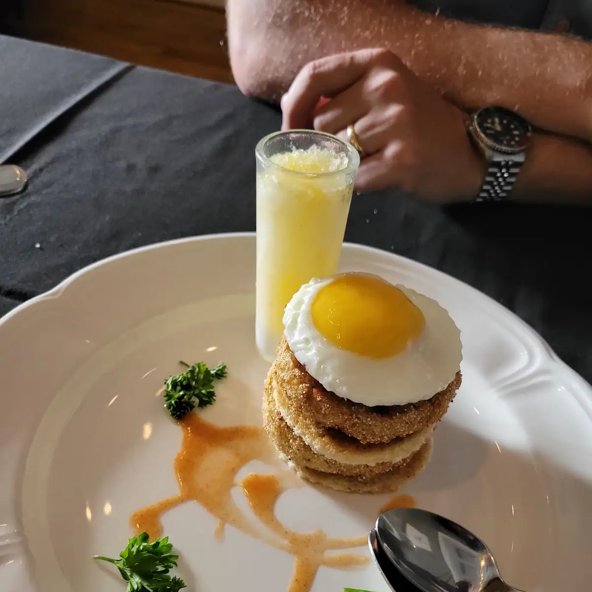Fried Green Tomatoes with Bacon Jam Brioche Fried Egg Hot Sauce and Mimosa Ice