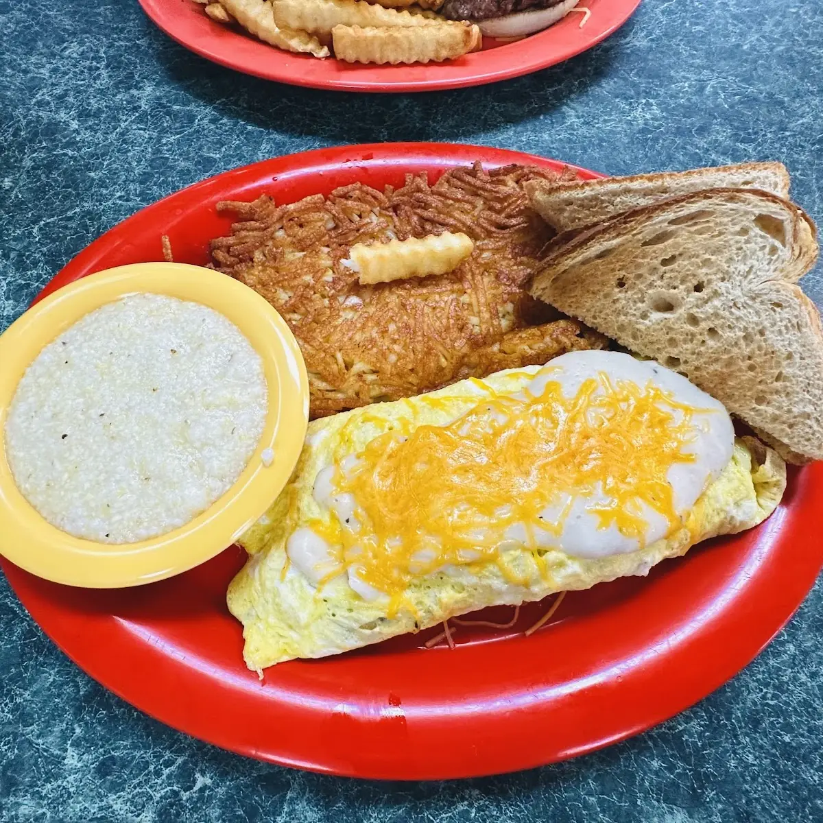 Egg Plate with Hash Browns Grits & Toast