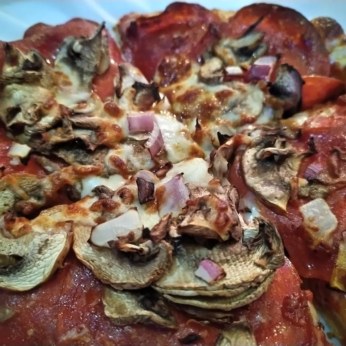 Personal Pan Pizza with Cheese Pepperoni Onions and Mushrooms