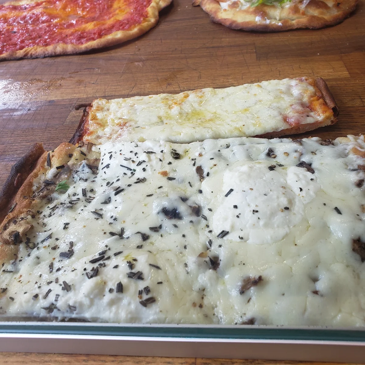 Top Plain Cheese Pizza Bottom Veggie Pizza with Mushroom and Feta