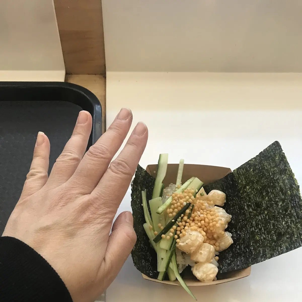 Scallop Hand Roll with My Hand for Size Comparison