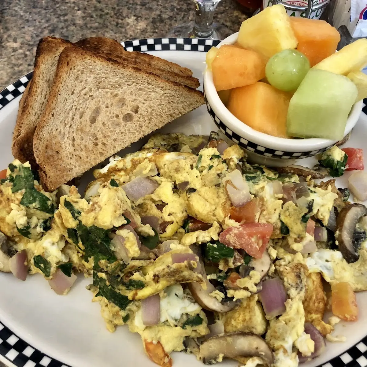 Garden Scramble with Real Eggs Instead of Egg Beaters 4 Slices of Whole Wheat Toast and Fresh Fruit