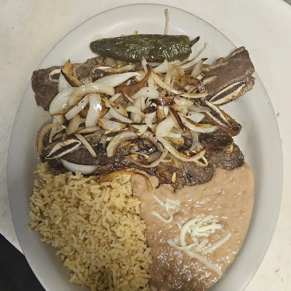 Bistec Encebollado