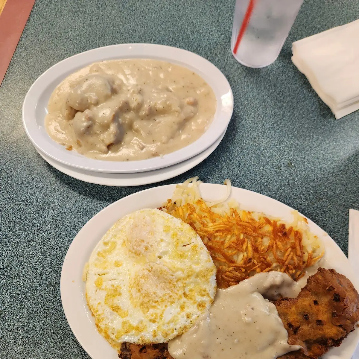 Chicken Fried Steak and Eggs and Side Biscuits and Sausage Gravy