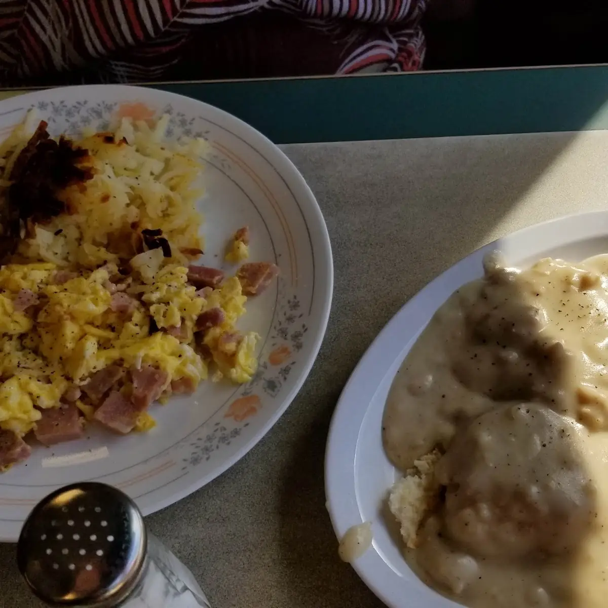 Scrambled Eggs with Diced Ham and Hashbrowns Biscuits and Gravy on the Side
