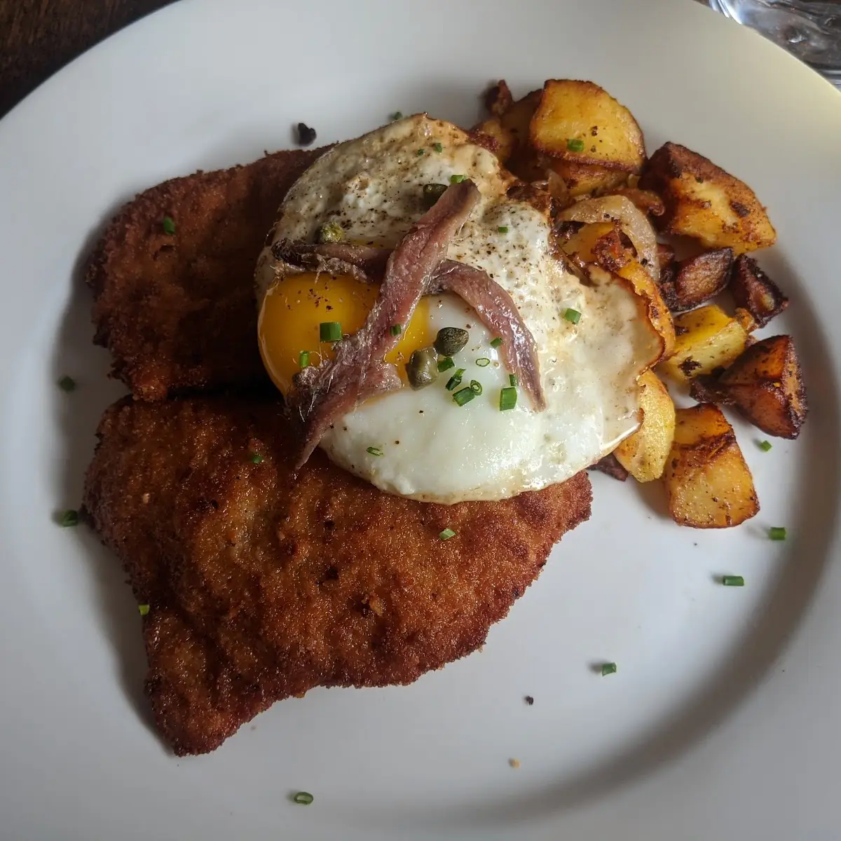 Schweineschnitzel Thinly Pounded Pork Loin Breaded & Fried Served with Potato Salad or Potato Gratin