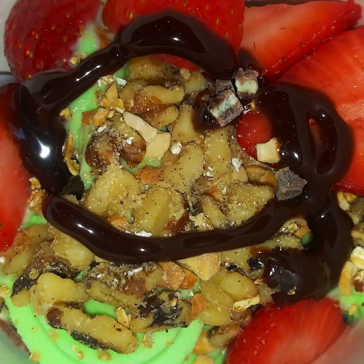 Mint Ice Cream with Almonds and Pistachio with Strawberriesand Hot Fudge
