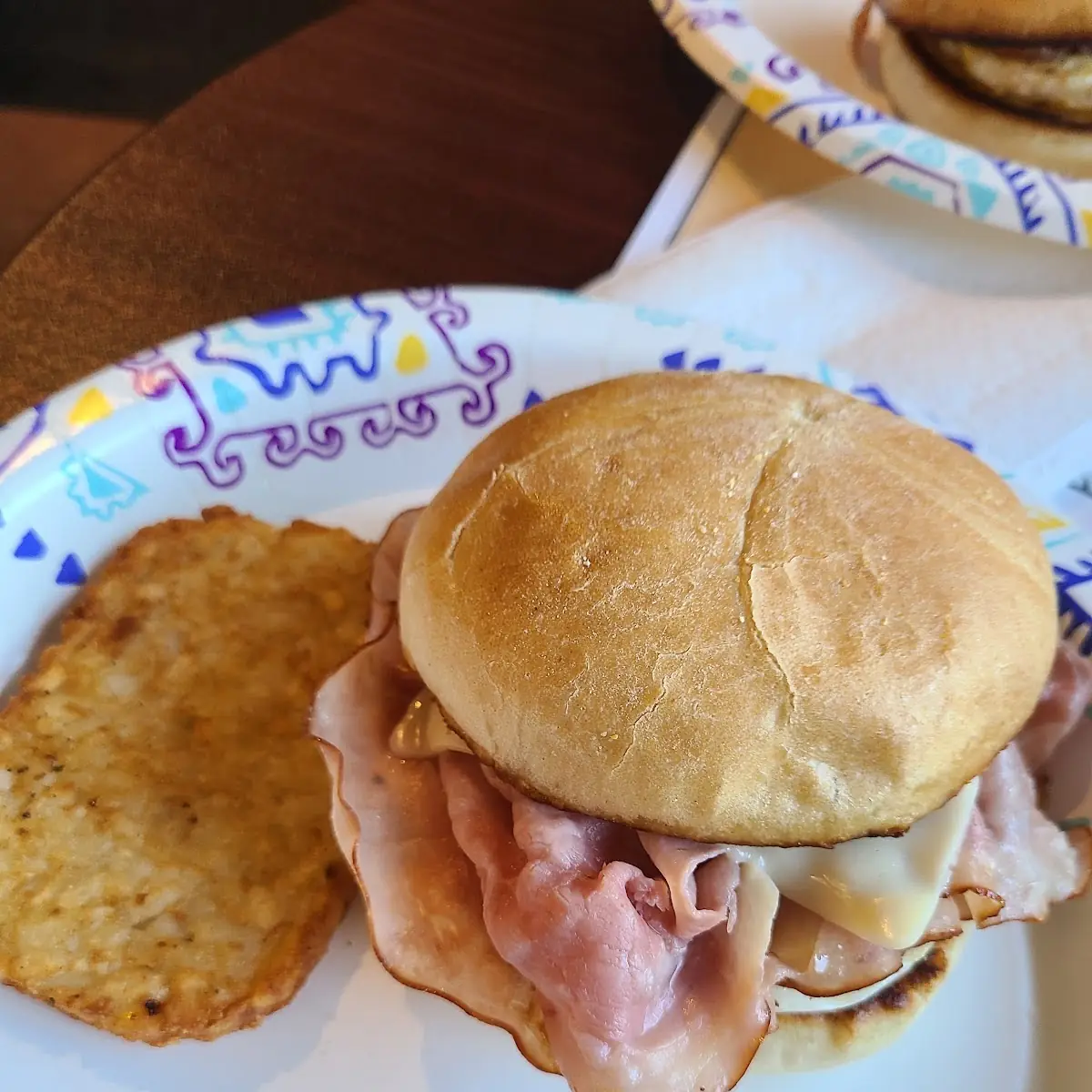 Egg and Cheese and Ham Breakfast Sandwich and Hashbrown