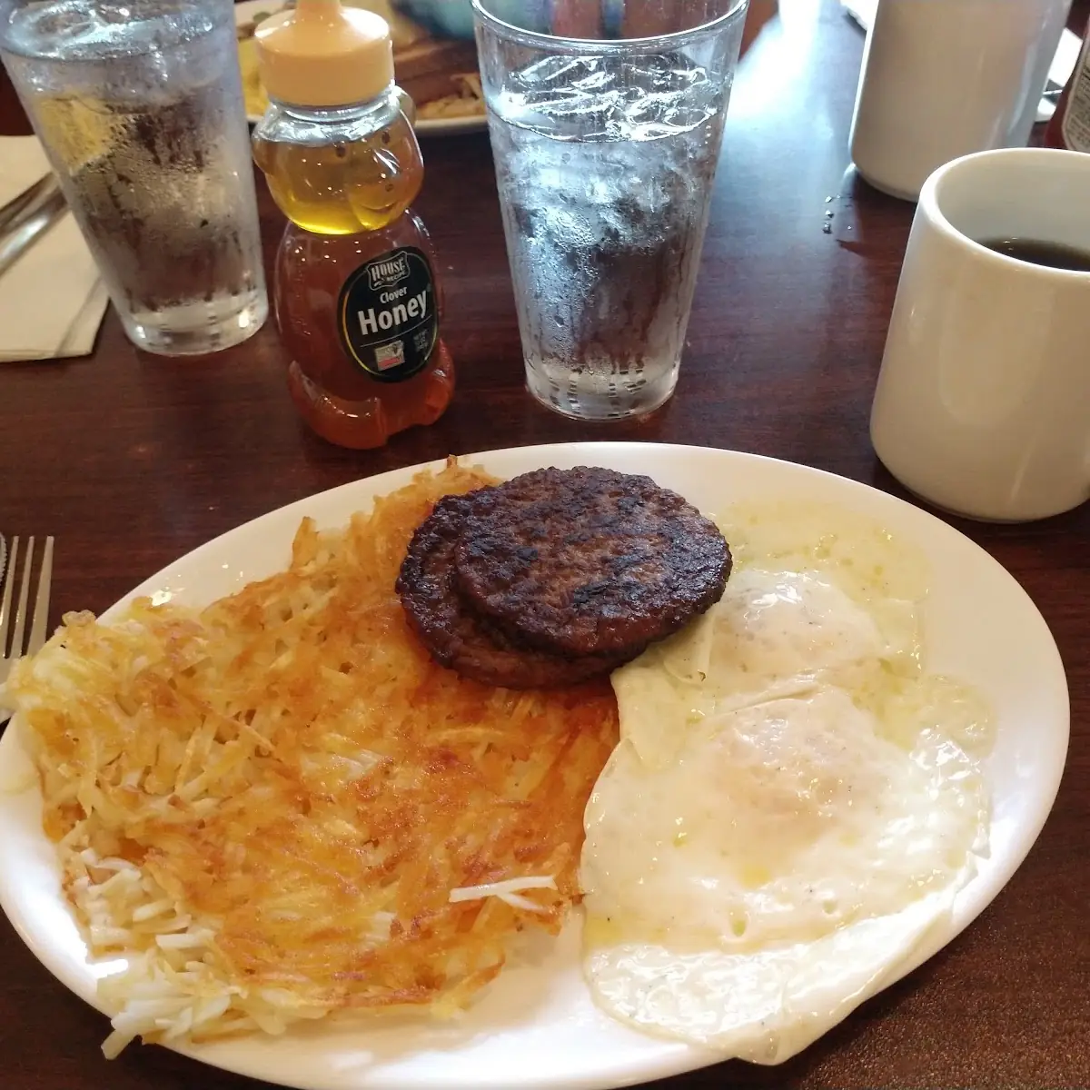 Sausage Patties Hash Browns and Two Egg Breakfast