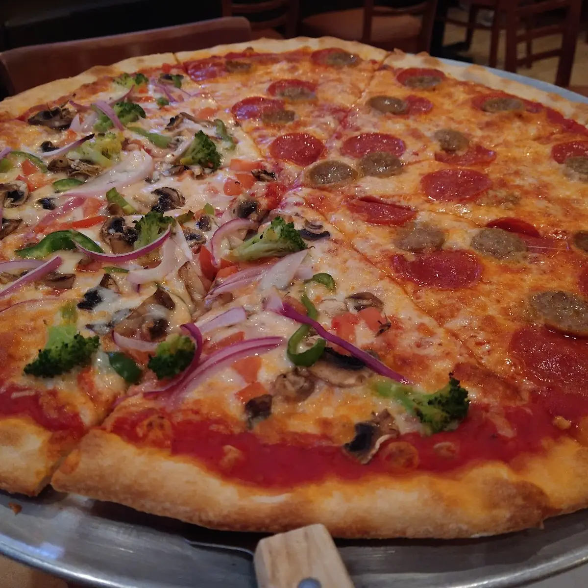 Half Veggie Pizza Half Pepperoni and Sausage