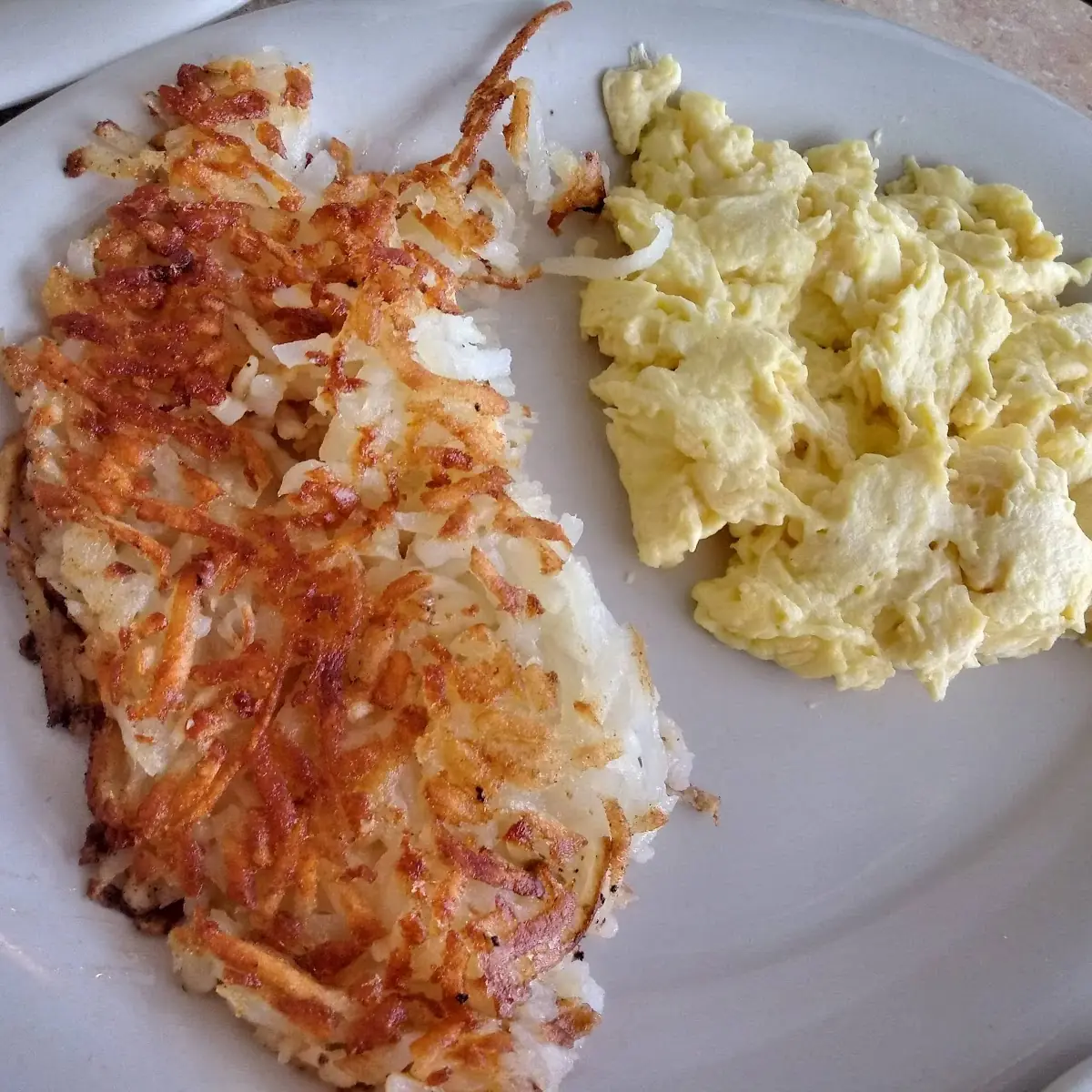 Eggs Benedict with Corned Beef Hash and Hash Browns