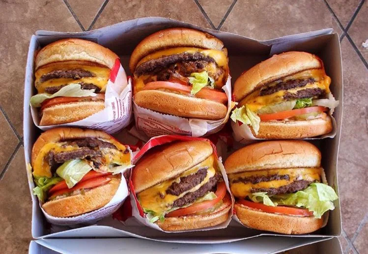 Double-Double Cheeseburger Animal-Style with Raw Onions Added