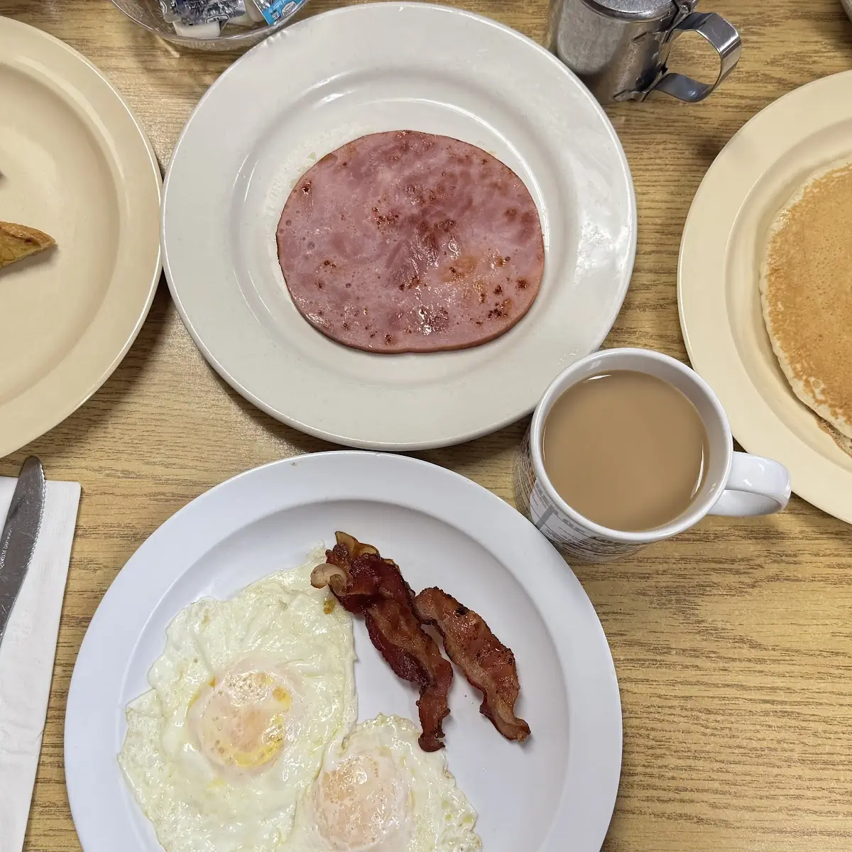 Two Eggs Potatoes or Grits and Your Choice of Bread