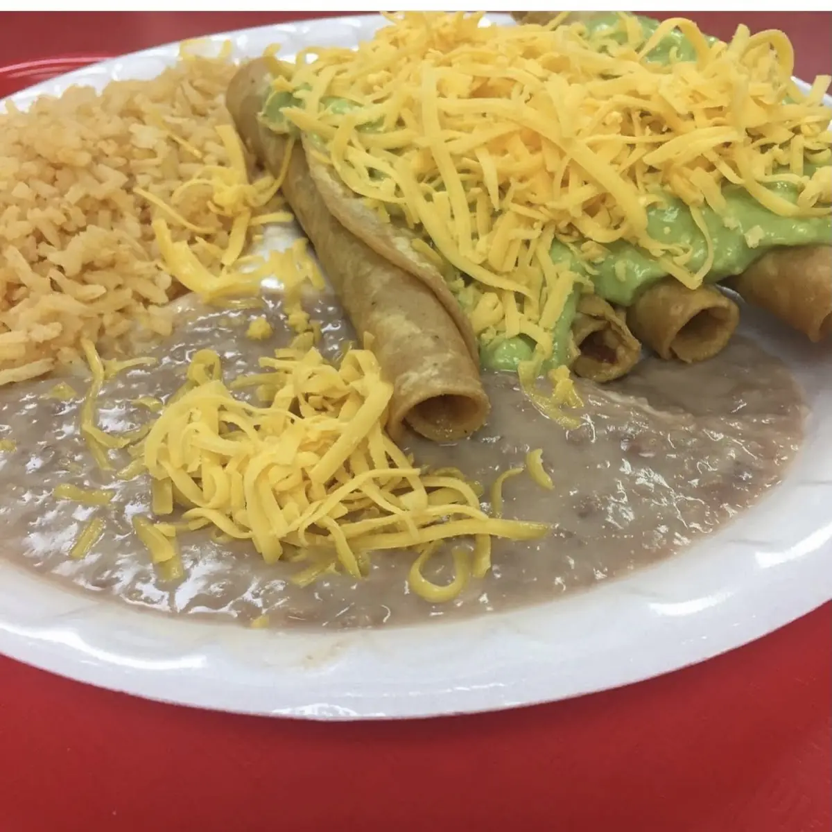 Rolled Tacos w Guac Cheese Rice & Beans Combination