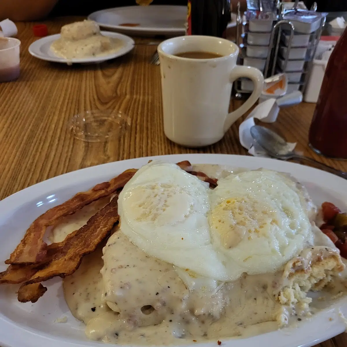 2 Eggs over-Medium on 2 Biscuits & Gravy w Extra Crispy Bacon