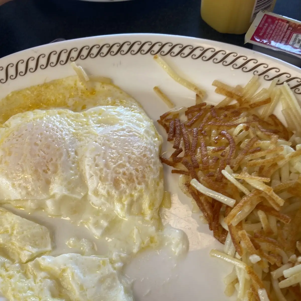 Undercooked over Medium Eggs with Hash Browns