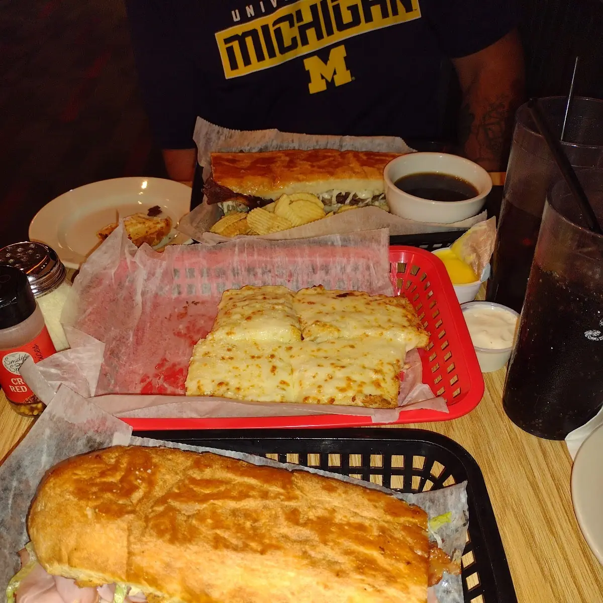 French Dip and a Cavoni's Club with Cheese Bread