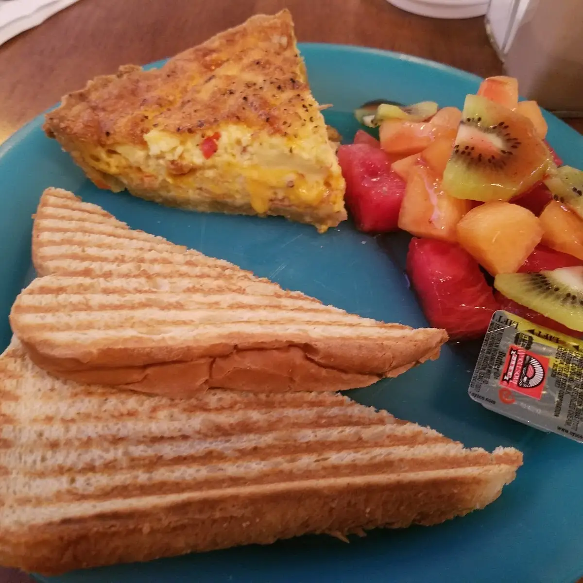 Bacon Cheddar Quiche with Fresh Fruit & Toast