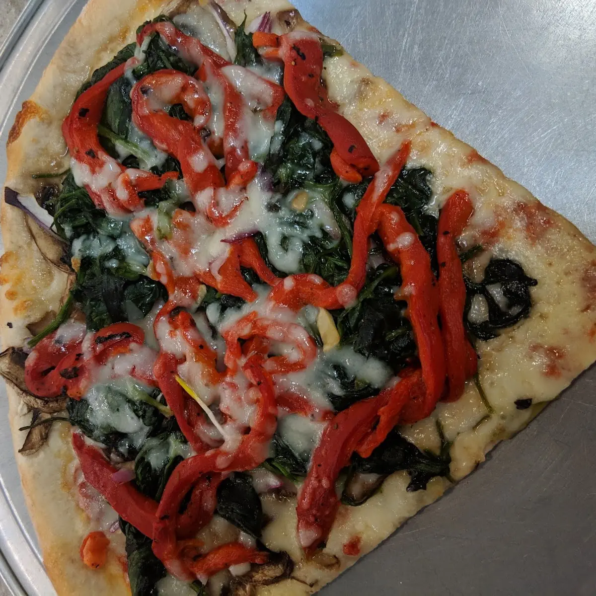 Countertop Vegetables Delight Pizza by the Slice