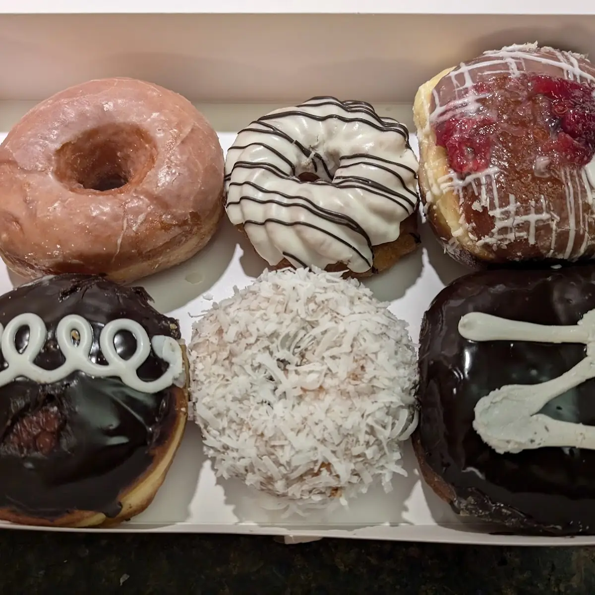 Glazed Donut Coconut Raspberry Doughnut