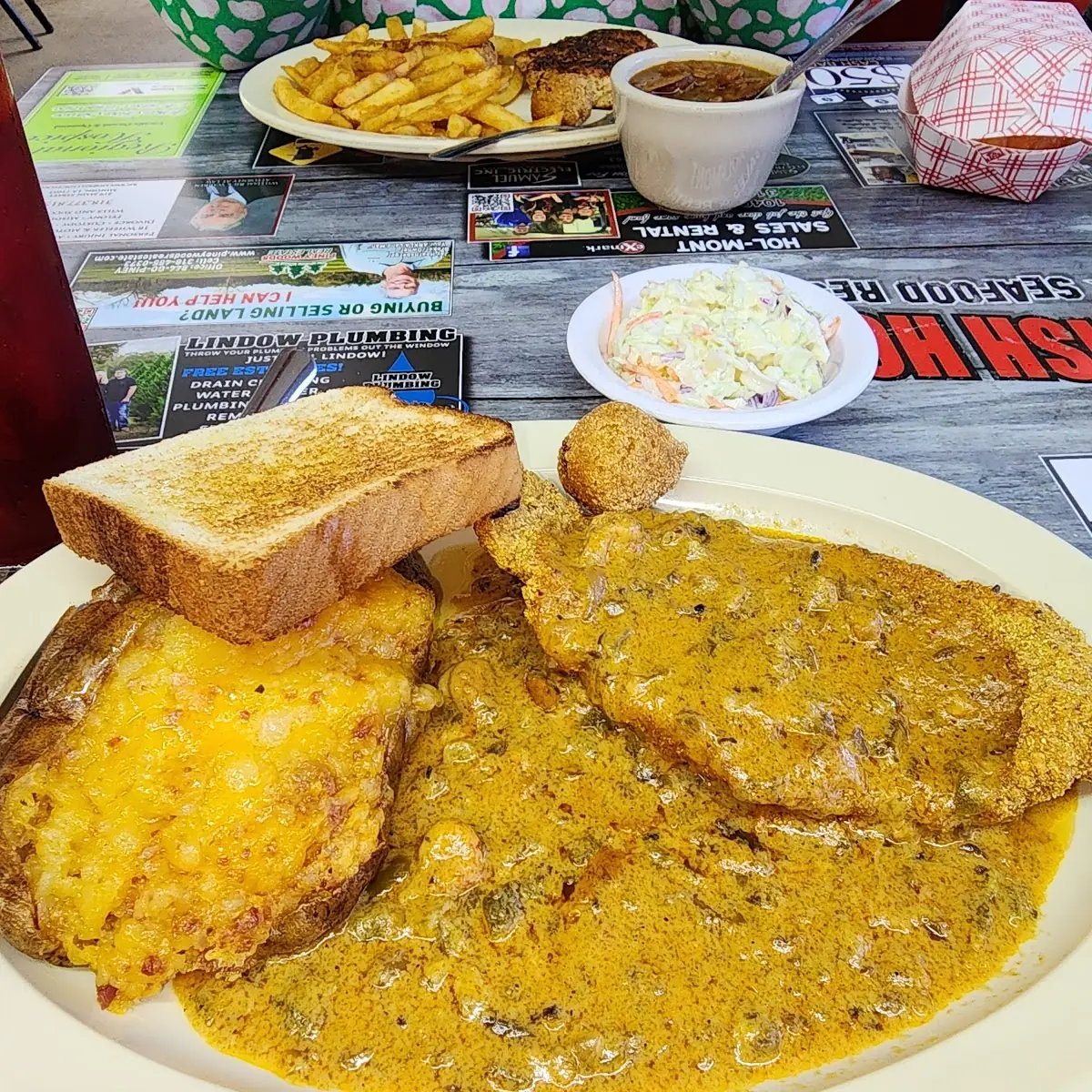 Catfish Supreme iThink Fried Catfish Filet Topped with Crawfish Etoufe & Stuffed Baked Potato