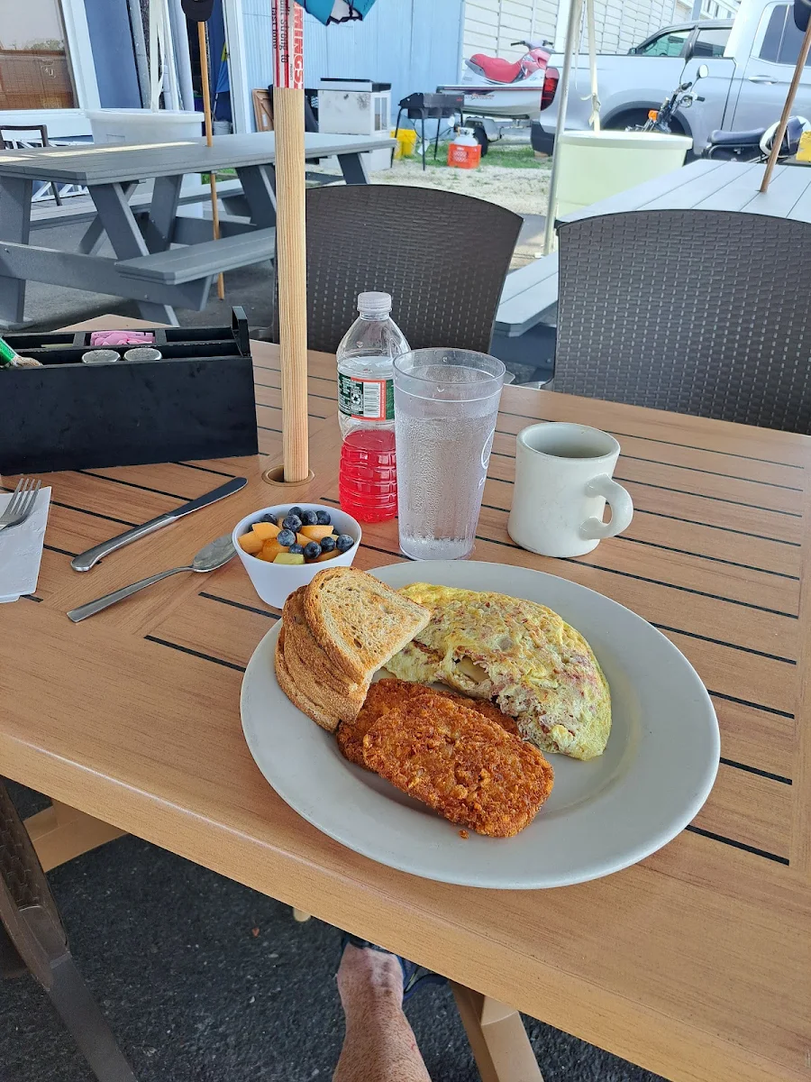 Omelets Corned Beef with 4 Eggs Deep Fried Hashbrowns and a Fruit Bowl