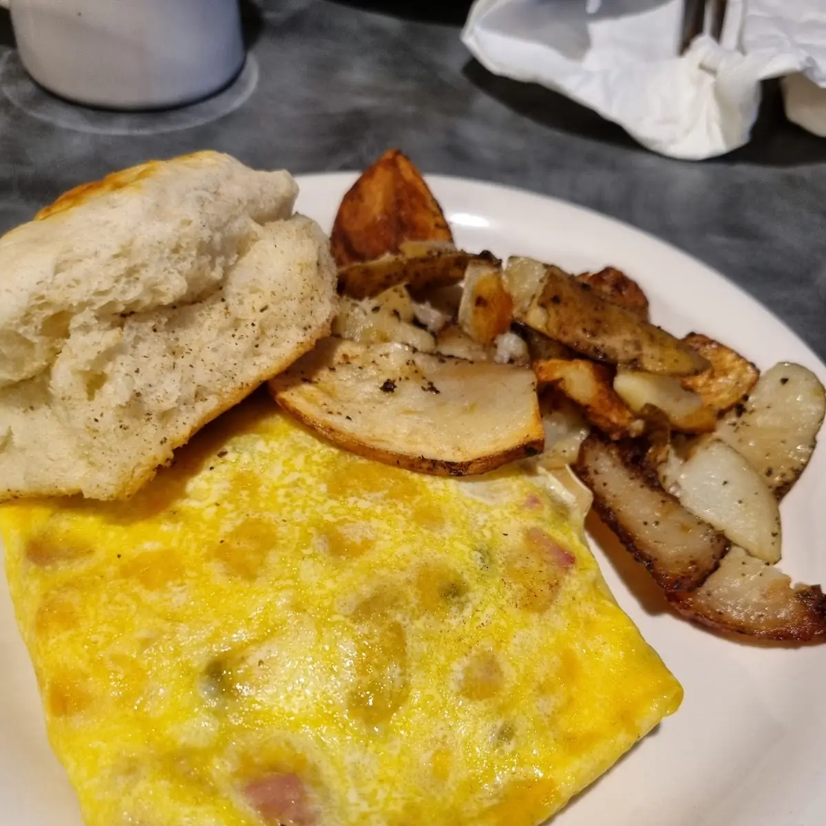Scrambled Eggs Home Fries and a Biscuit