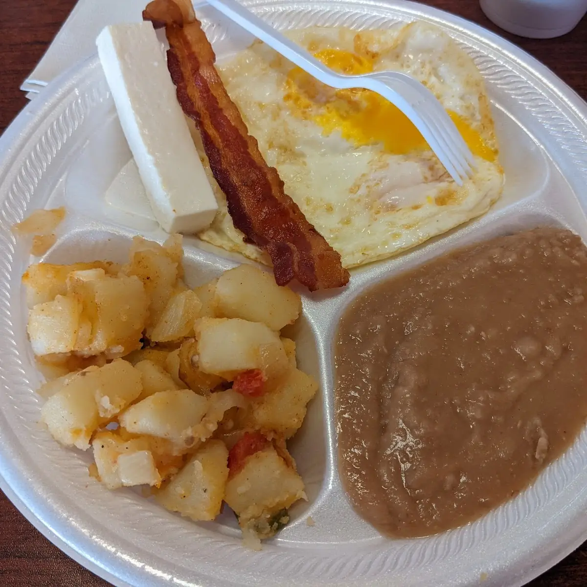 Fried Eggs Potatoes Bacon and Refried Beans