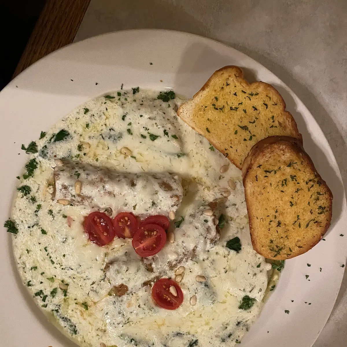 Portobello Ravioli with Garlic Alfredo Pine Nuts and Cherry Tomatoes