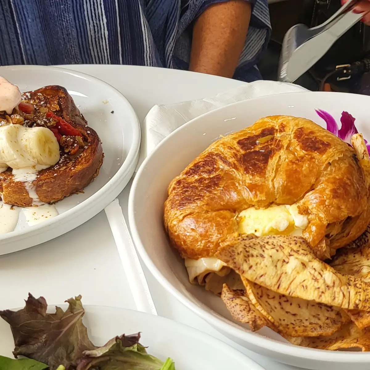 Waffle with Fruit and Croissant Sandwich with Egg and Turkey
