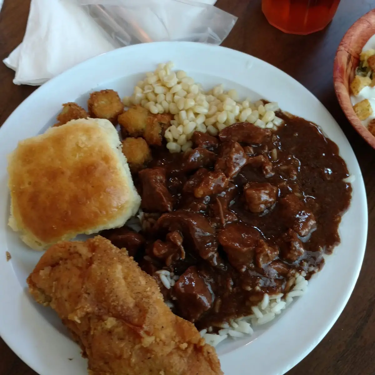Stew Beef an Rice with Fried Chicken Fried Squash Corn an Biscuit