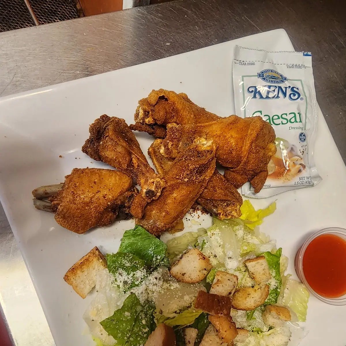 Old Bay Wings with a Caesar Salad