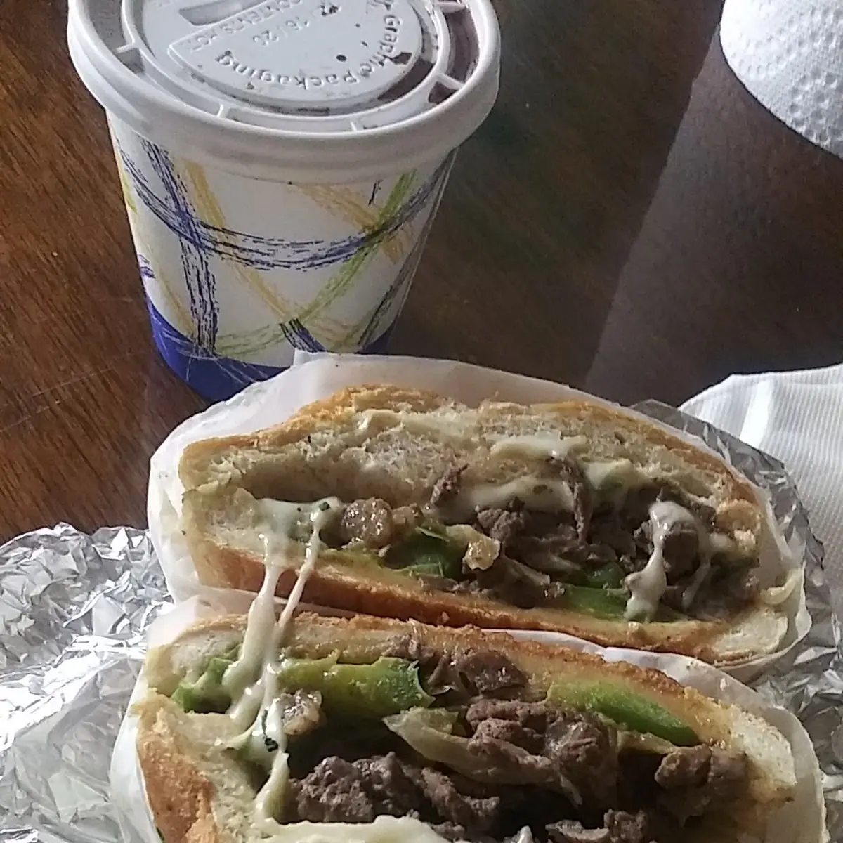 Philly Cheese Steak with Onions Peppers Cheese and Mayo
