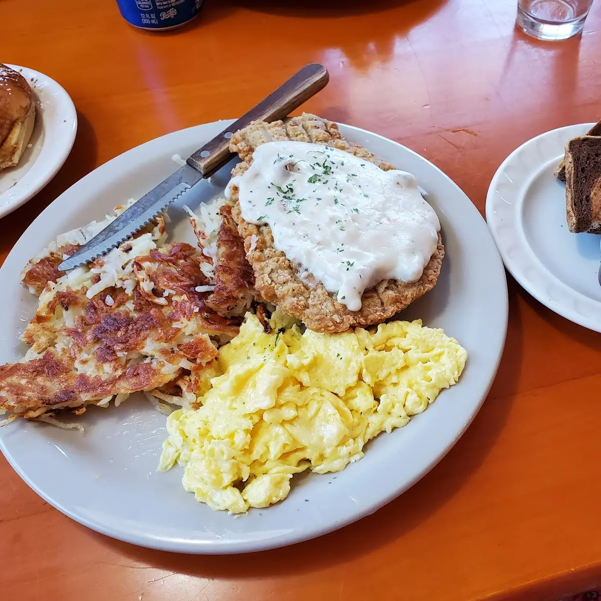 Chicken Fried Steak with Hashbrowns Scrambled Eggs and Marble Rye Toast