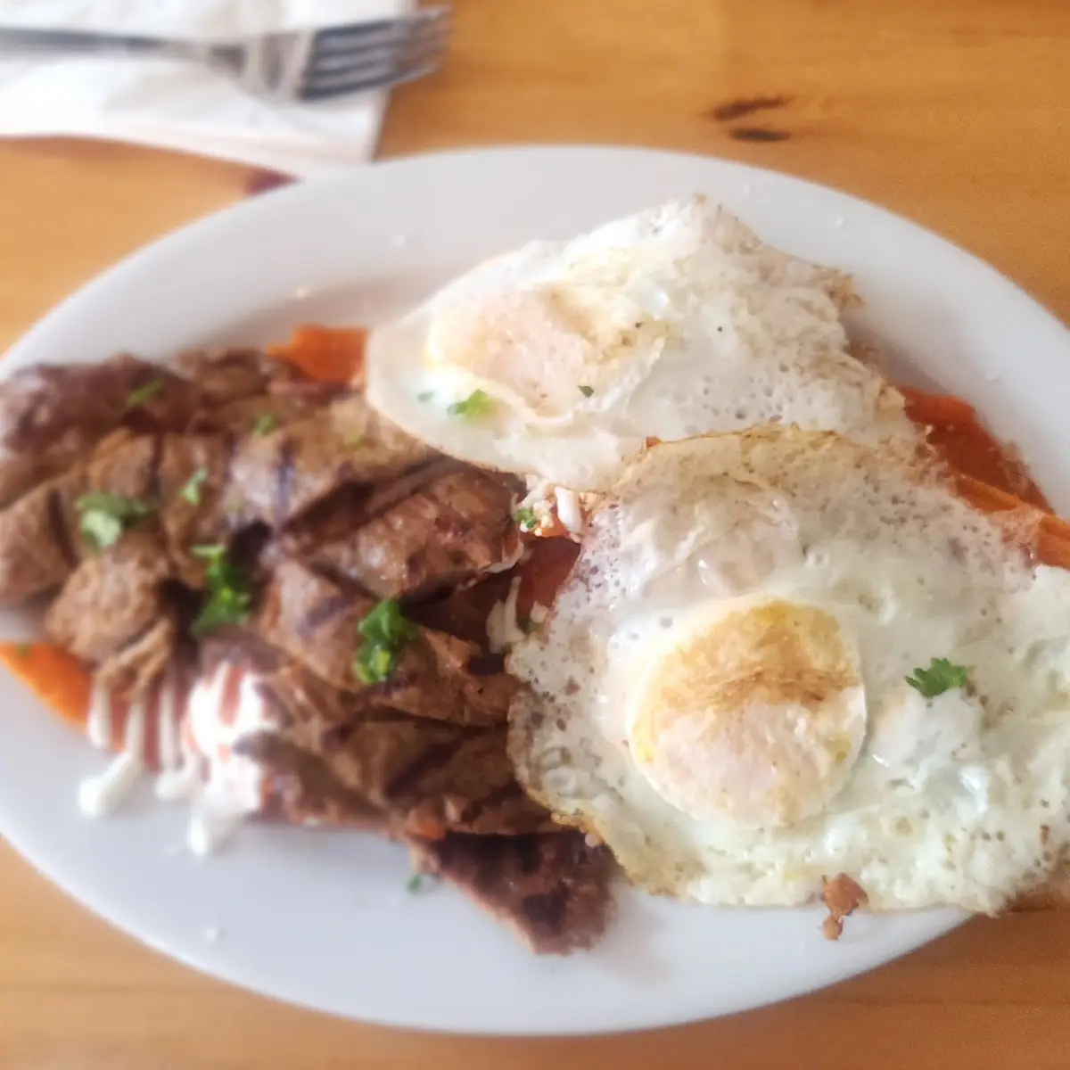 Chilaquiles Platter with Eggs Sunny Side Up & Steak