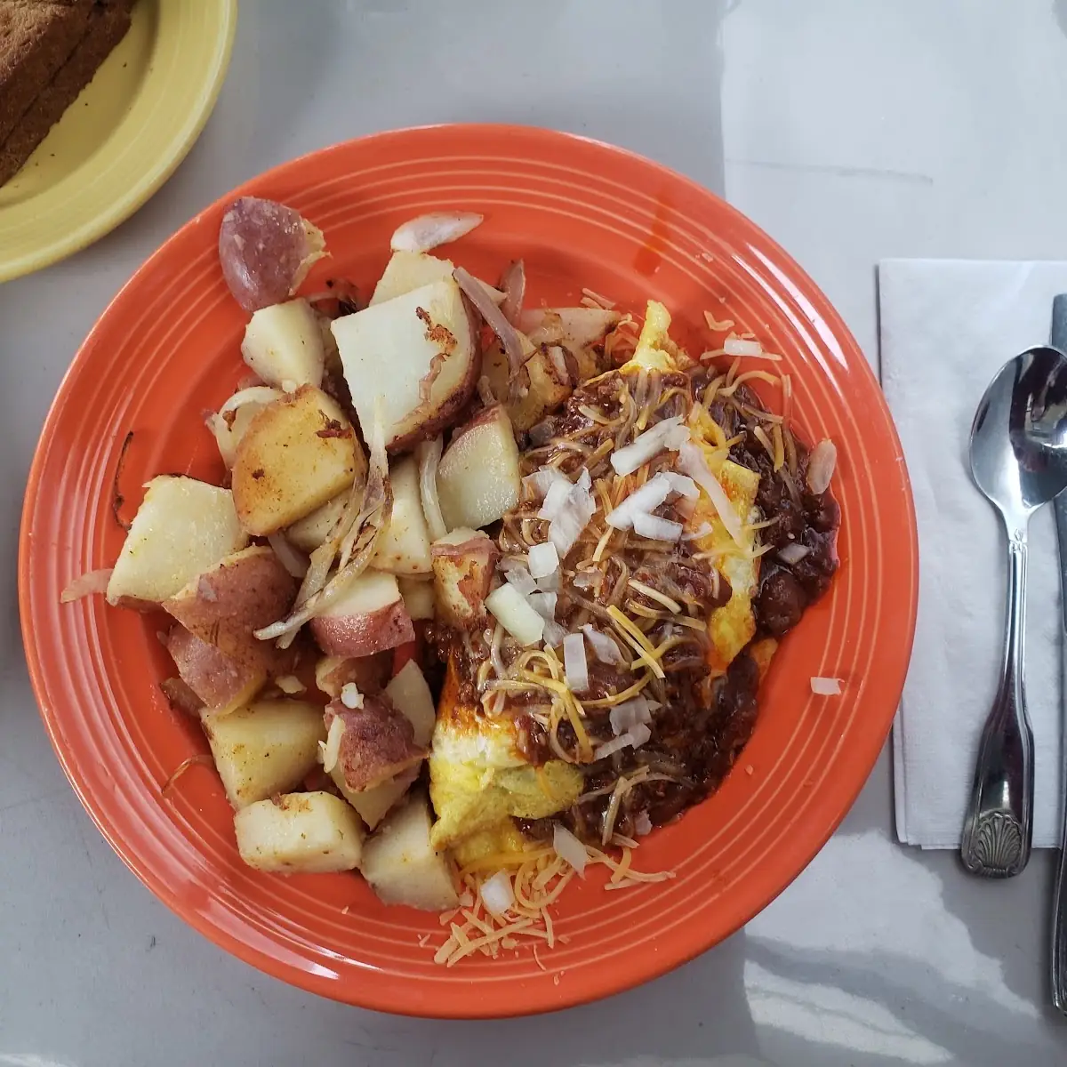 Chili Cheese Omelet with Home Fries Plus