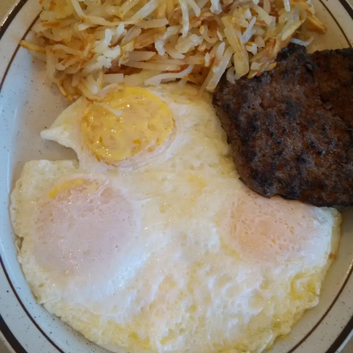 Eggs over Medium Sausage and Hash Browns