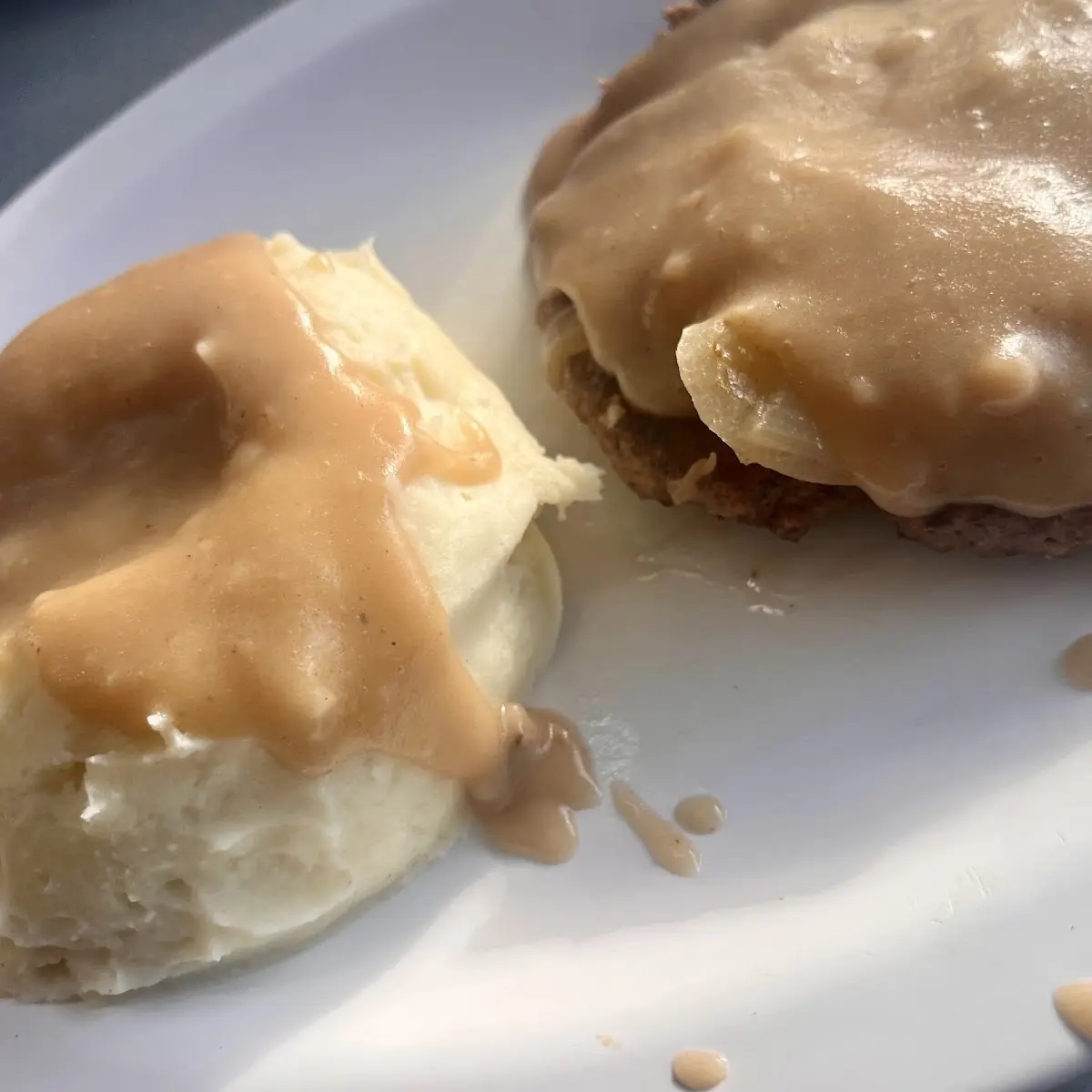 Mashed Potatoes with Hamburger Steak Smothered in Onions