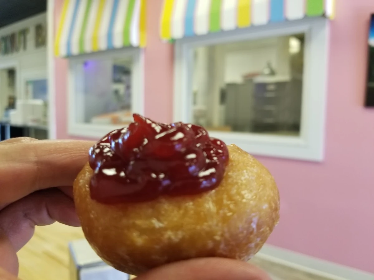 Gluten Free Glazed Donut with Raspberry Filling on Top