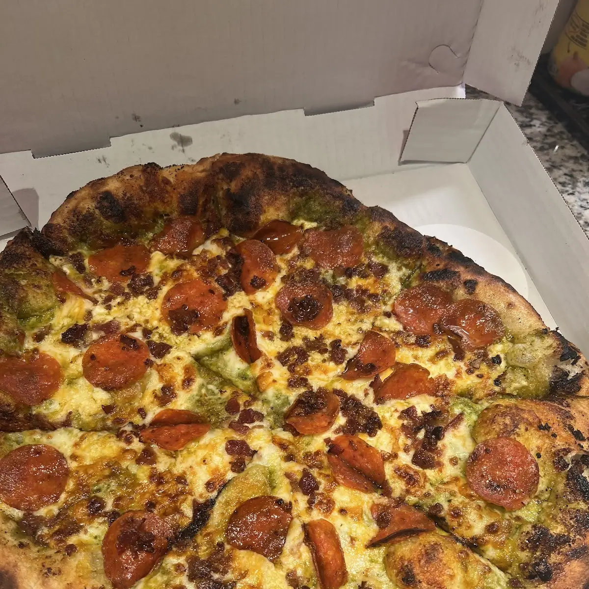 Pepperoni Pizza with Pesto and Cheese